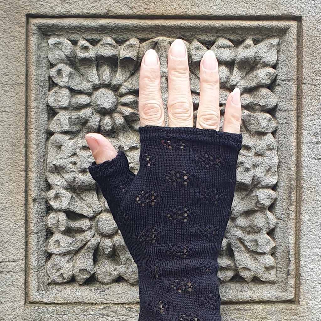 Black holes knit merino fingerless gloves